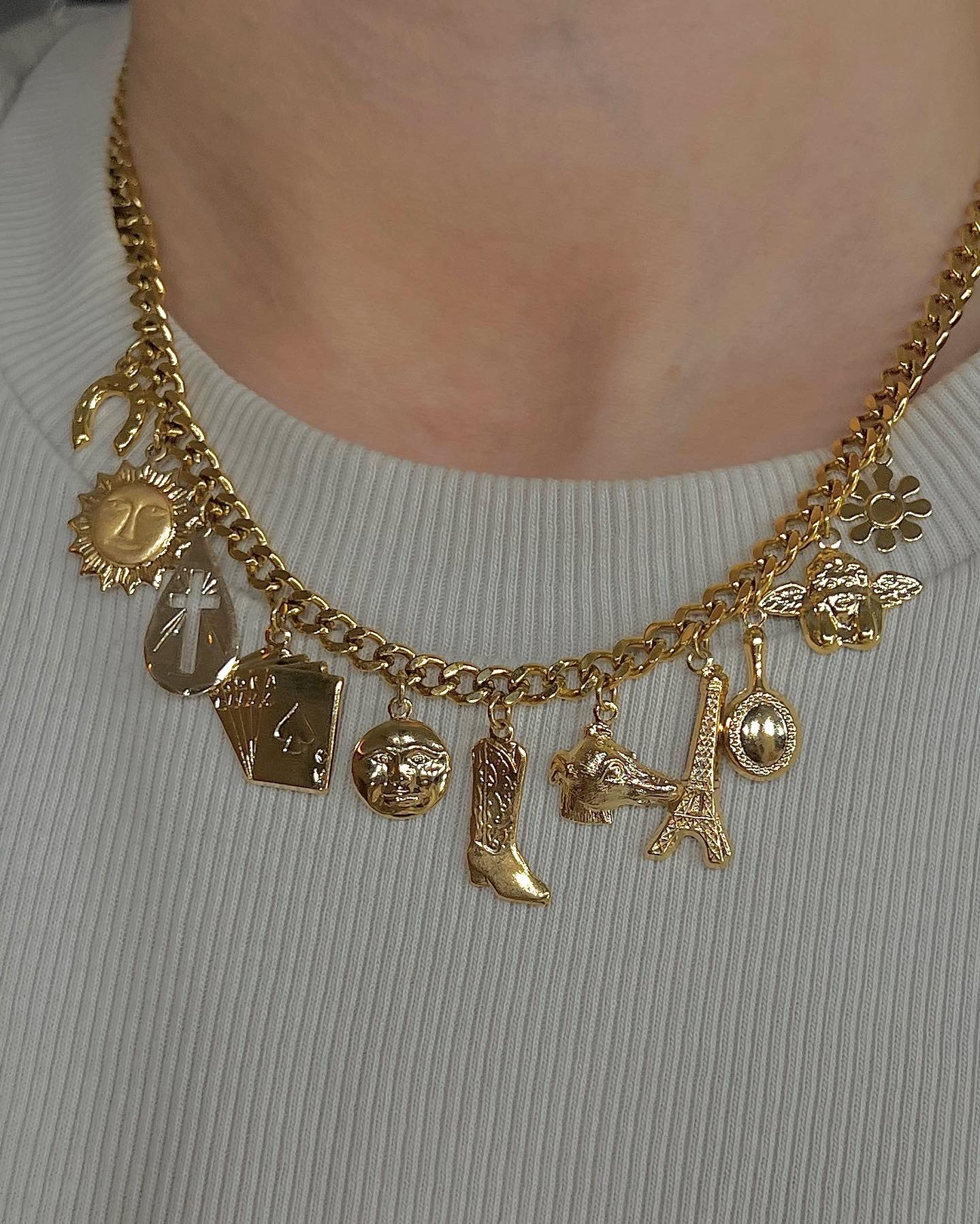 Multi-charm gold necklace