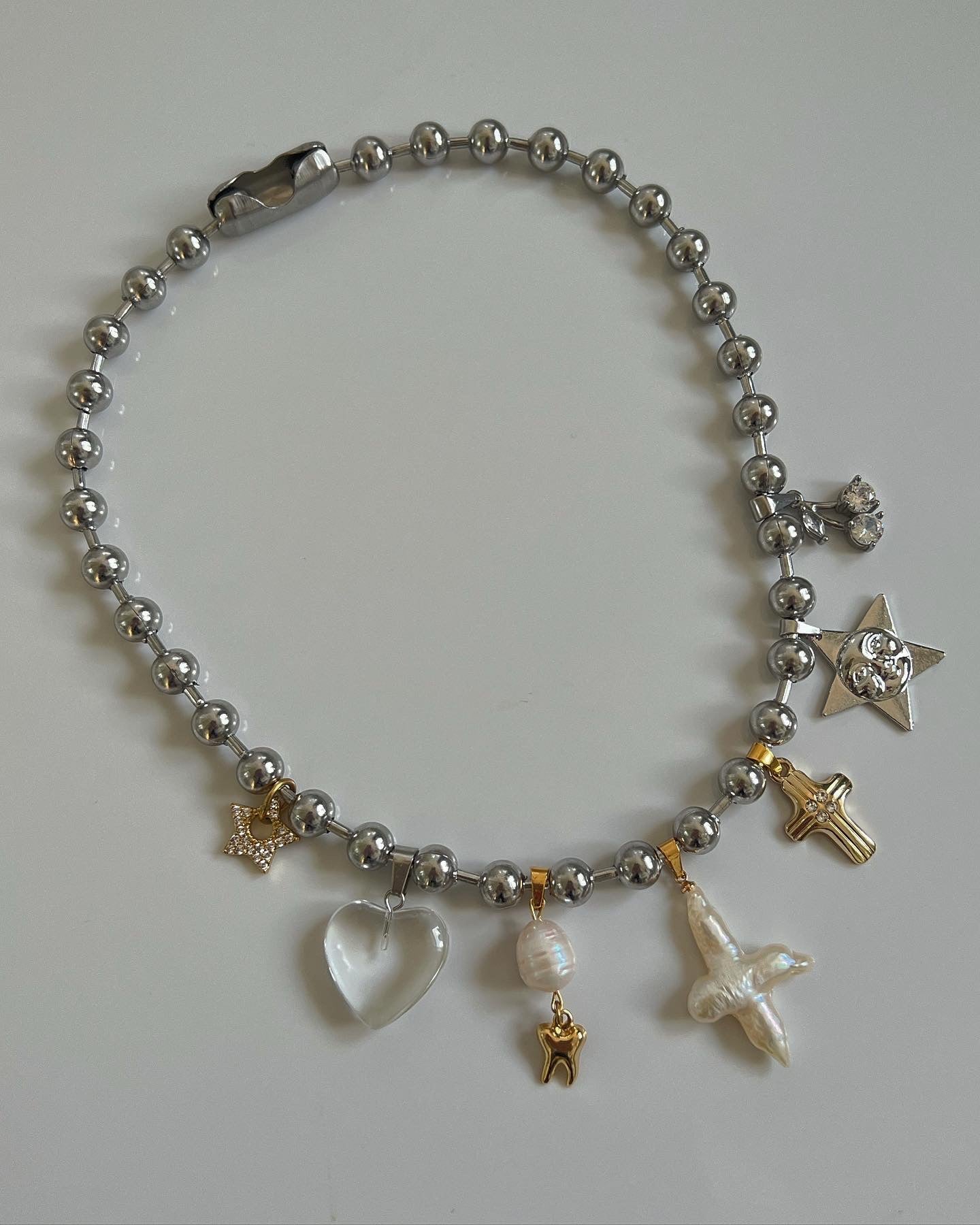 Multi-charm 2 tone necklace